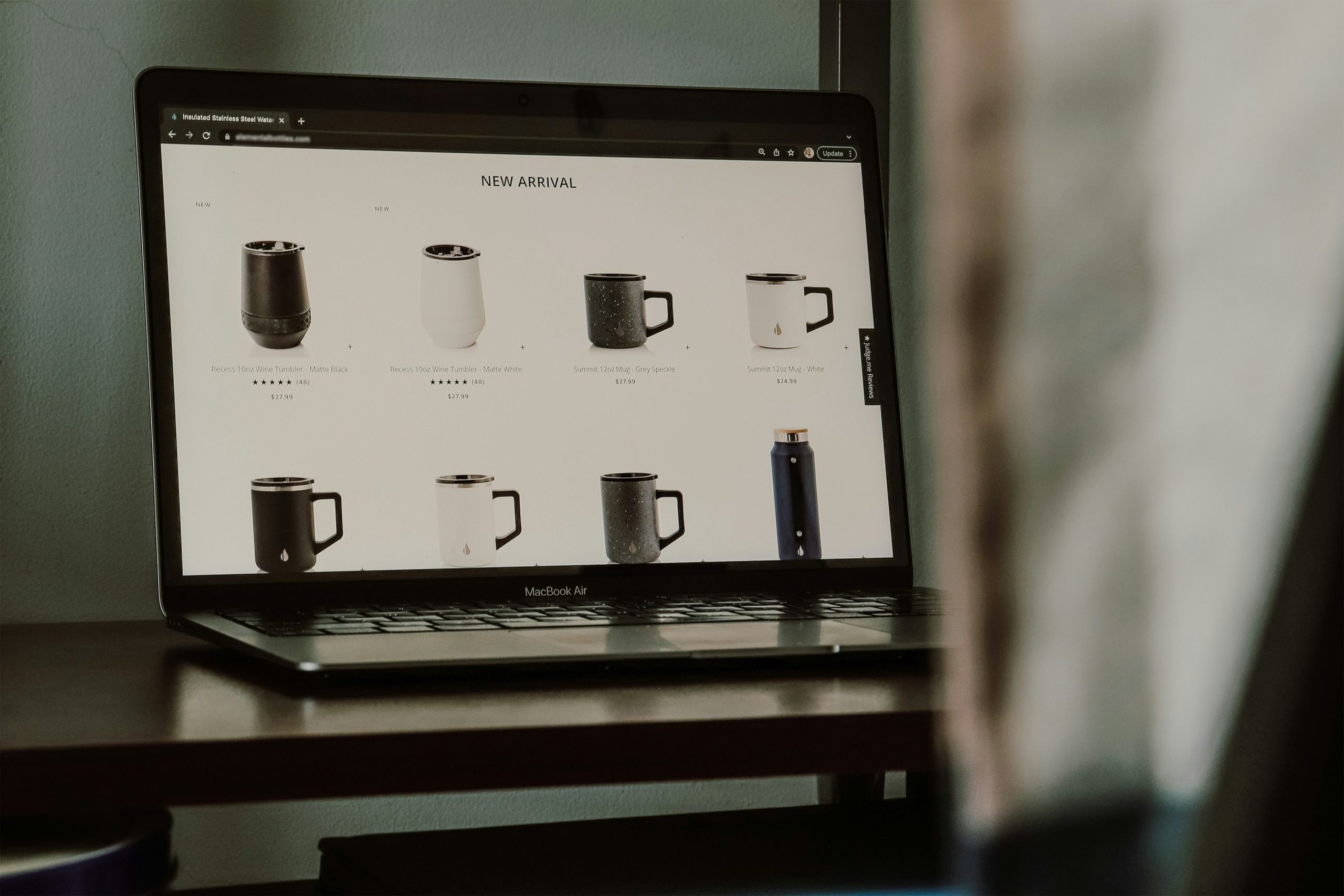 Your Brand - a loptop with a online store page on screen